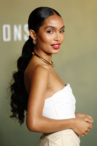 Yara Shahidi wearing a long curly ponytail