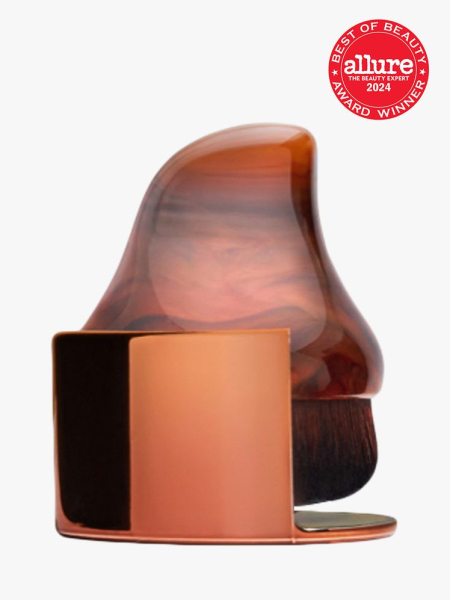 brush with handle in brown color way on light gray background with red and white 2024 allure best of beauty seal